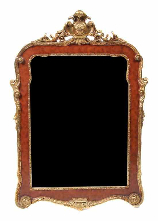 A George II Style Parcel Gilt Mirror having a plume