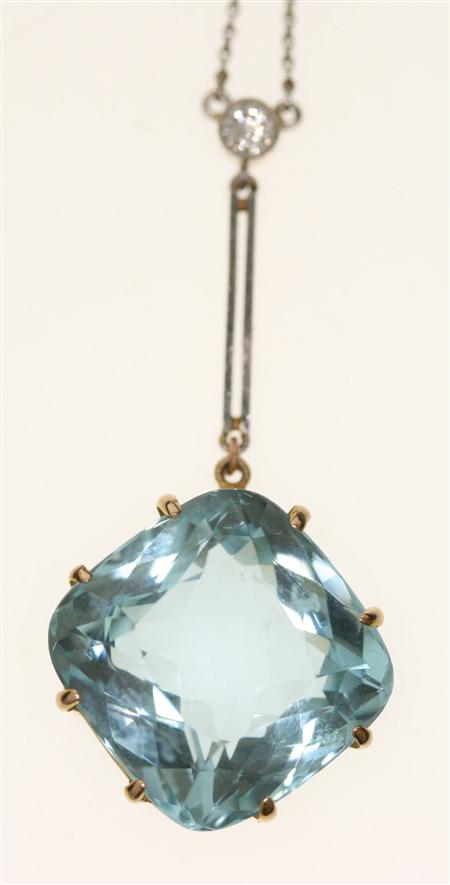 An aquamarine and diamond pendant necklace the large cushion cut