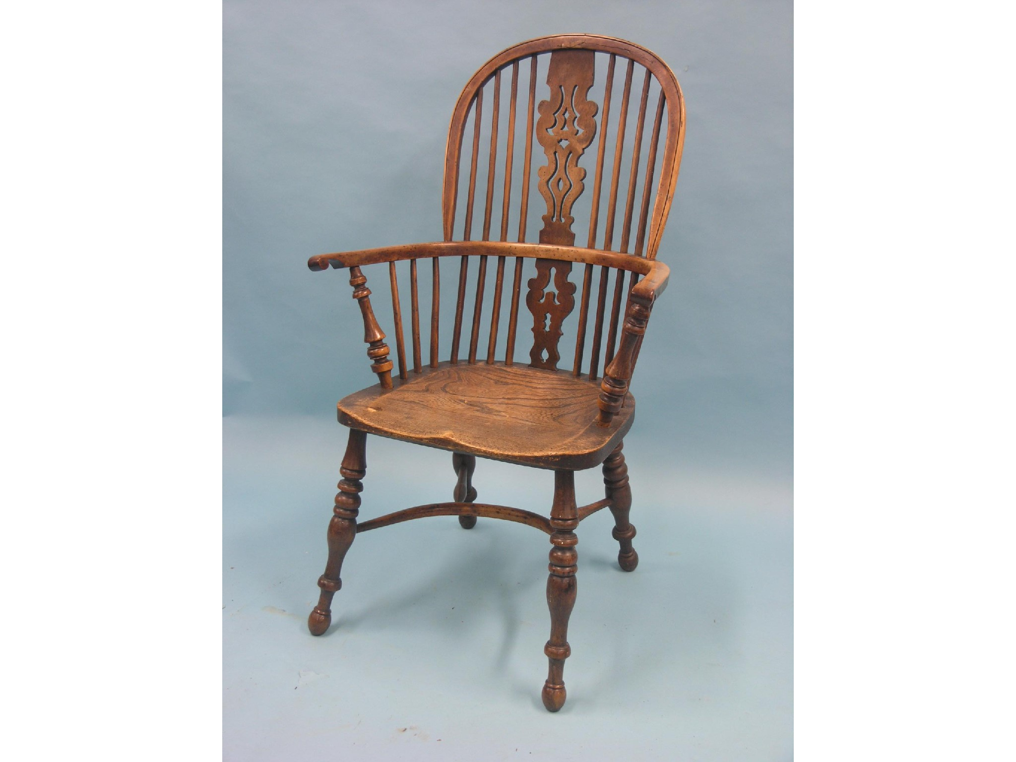 A Victorian yew Windsor bow back armchair back with pierced