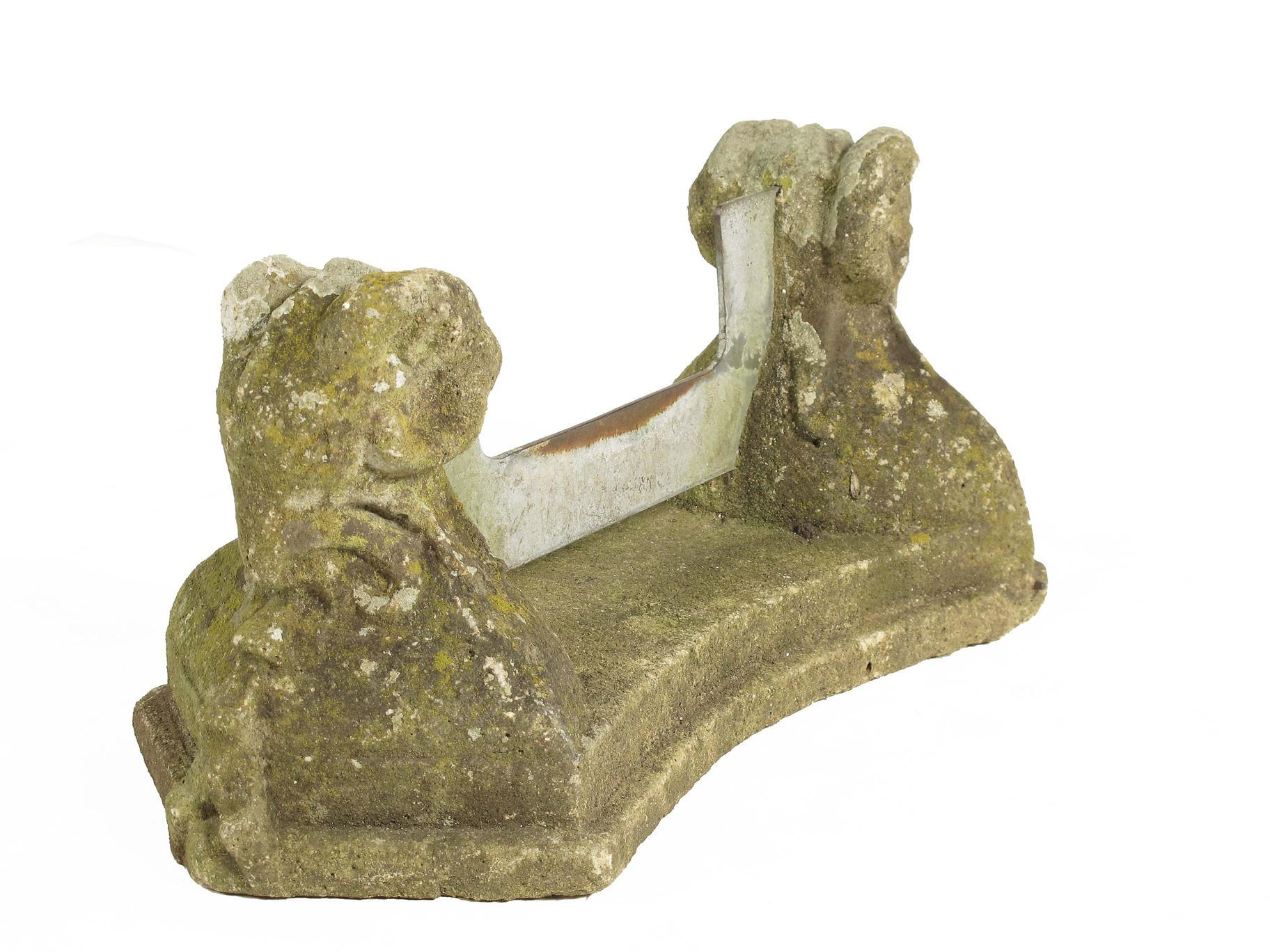 A reconstituted stone boot scraper