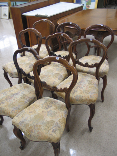 A GROUP OF EIGHT VICTORIAN BALLOON BACK DINING CHAIRS English