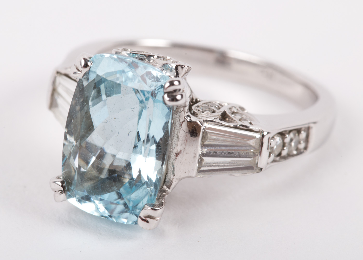 An Aquamarine Diamond Ring 14k white gold mounting contains a