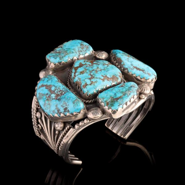 A NAVAJO BRACELET WITH FIVE MASSIVE MORENCI STONESThe handsome bracelet