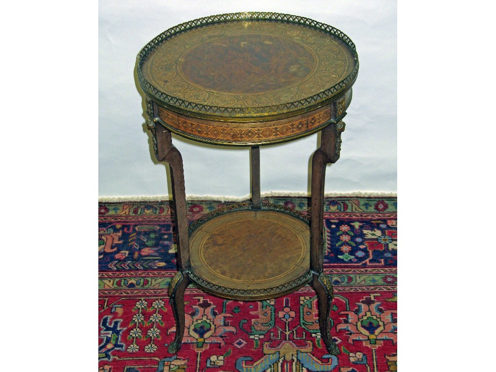 A 19th century circular walnut table with marquetry inlay and