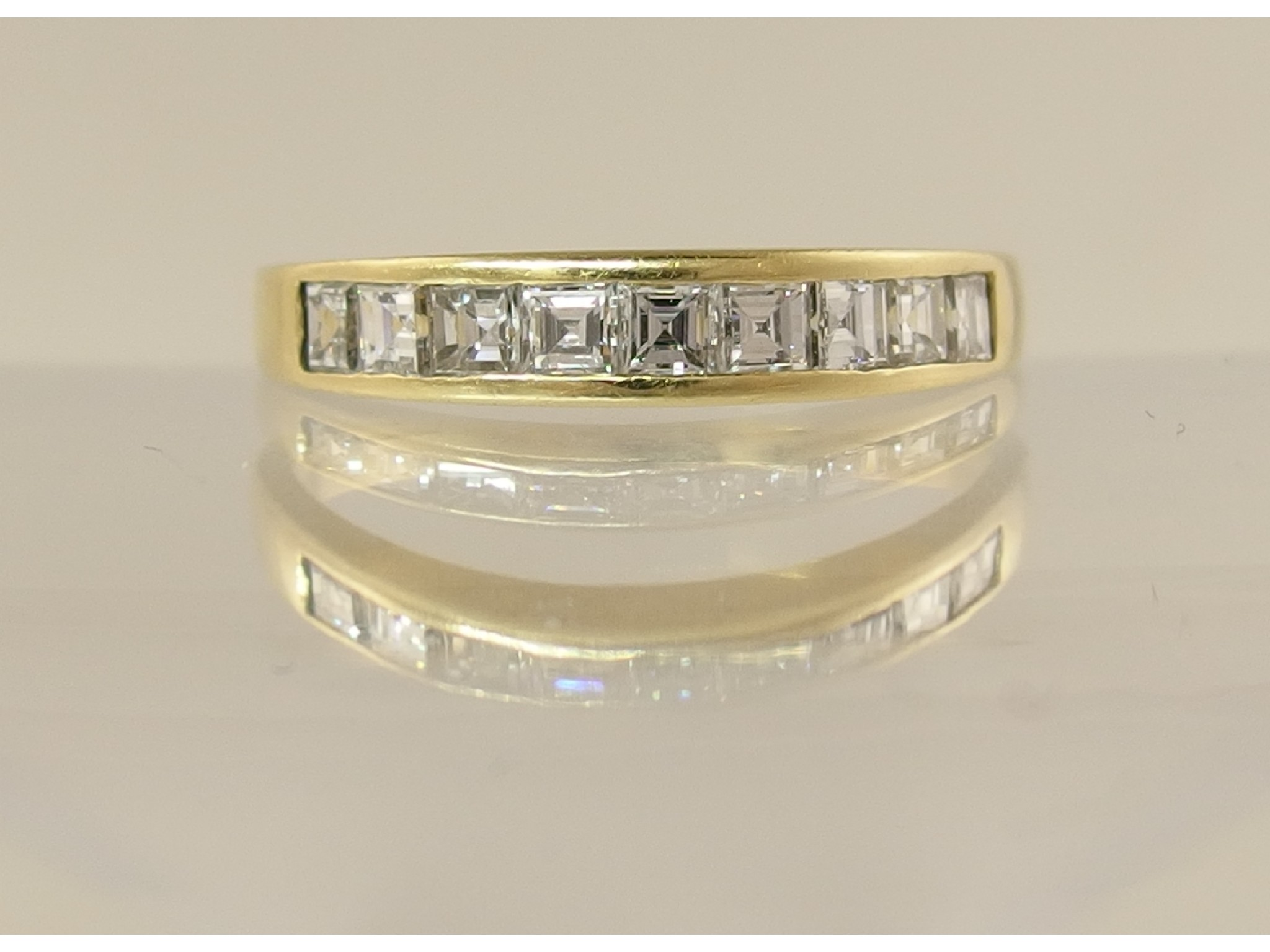 An 18ct yellow gold diamond set eternity ringset with nine