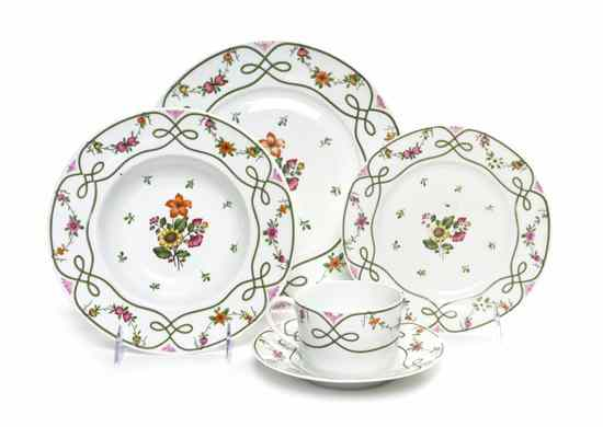 A Partial French Porcelain Dinner Service Limoges comprising 13 dinner