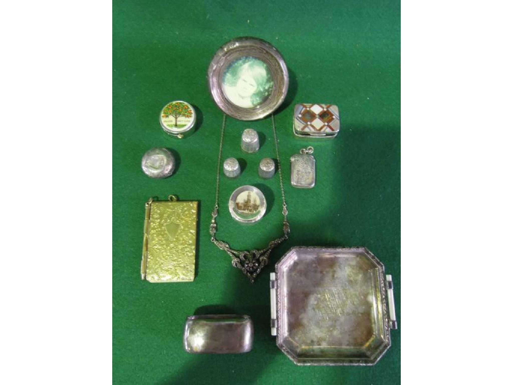 An interesting collection of items including a silver vesta case