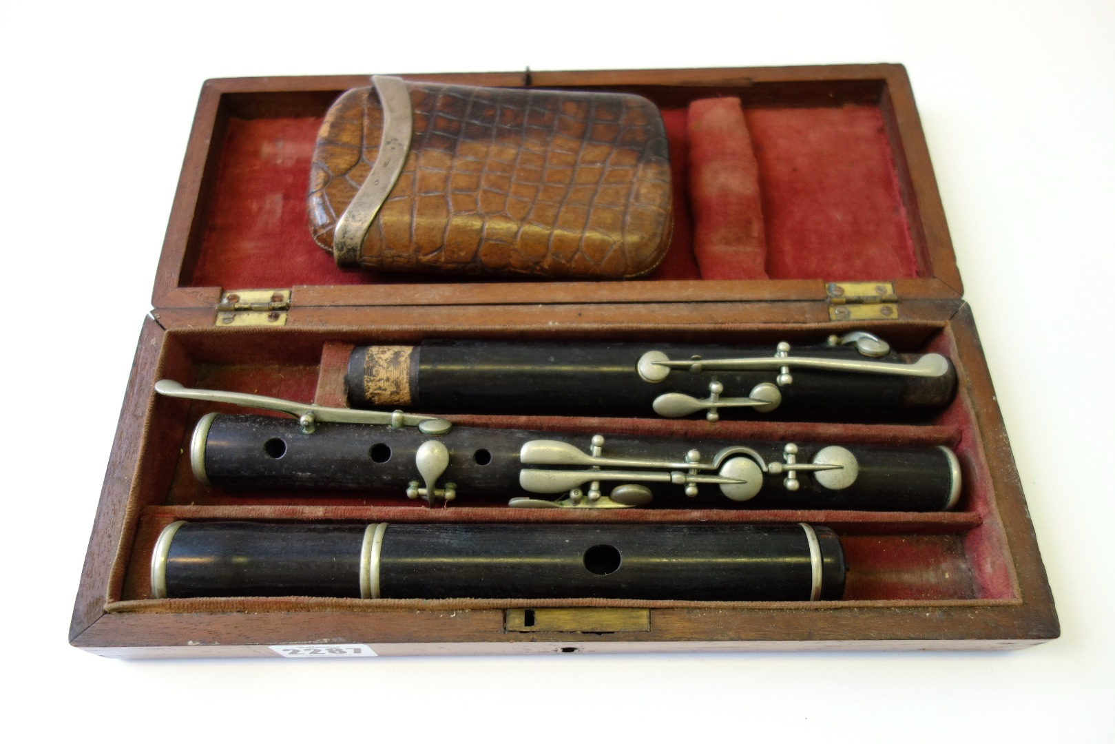 A three piece rosewood flute early 20th century cased an