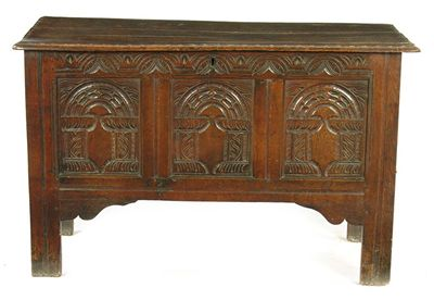 A late 17th century panelled oak chest the top with