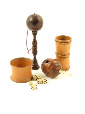 A 19th century turned boxwood dice shaker of waisted cylindrical