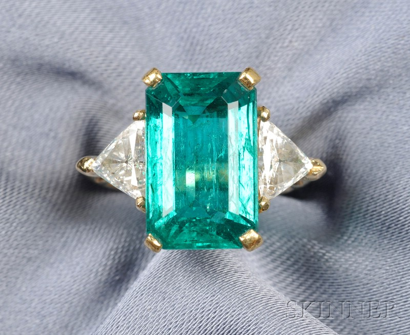 Emerald and Diamond Ring prong set with an emerald cut
