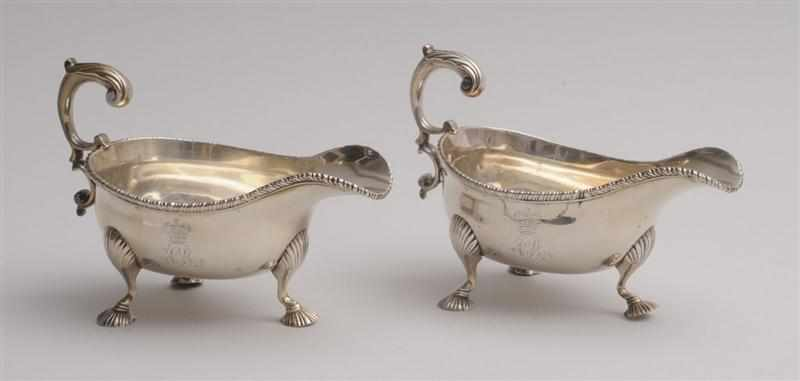 PAIR OF GEORGE II CRESTED AND MONOGRAMMED SILVER SAUCE BOATS