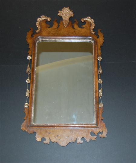 A 19th century walnut mirror In the George II style