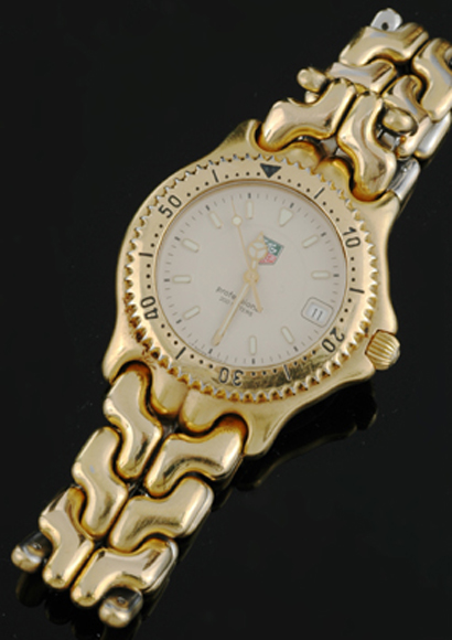 A Gents Tag Heuer wristwatch Quartz circular cream dial with