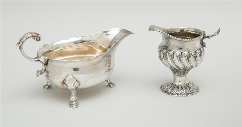 GEORGE II SILVER CREAMER AND A GEORGE III TRIPOD SAUCE