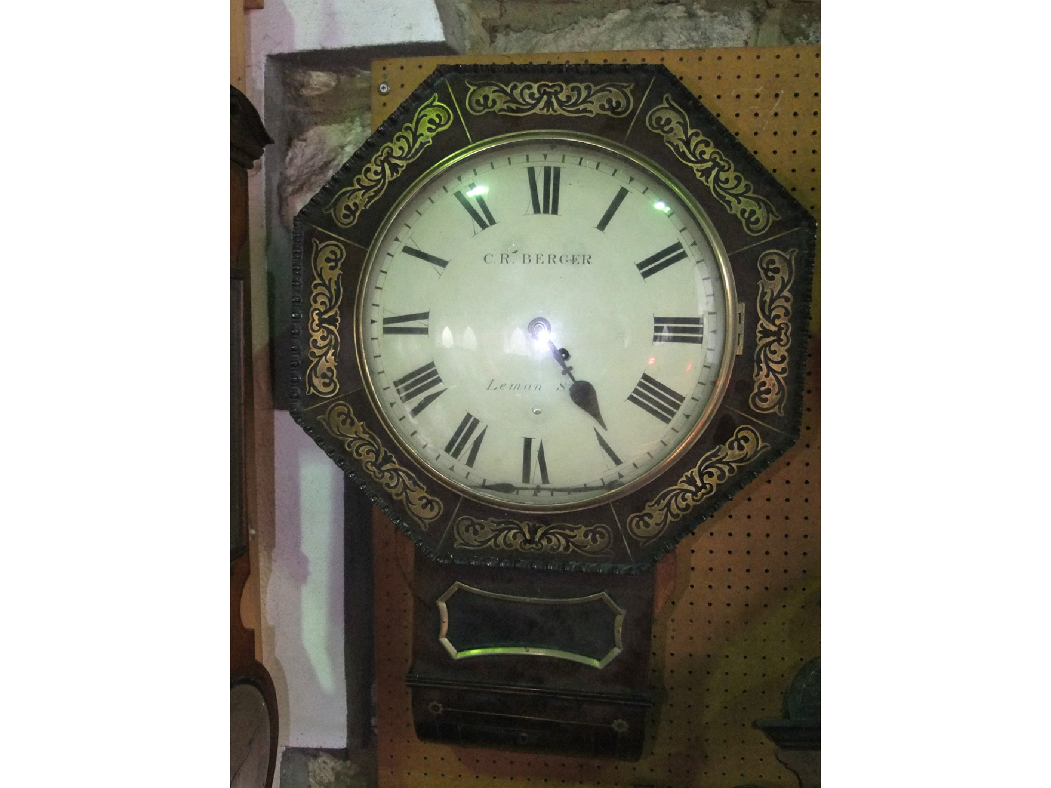 A Regency mahogany and brass inlaid drop dial wall clock