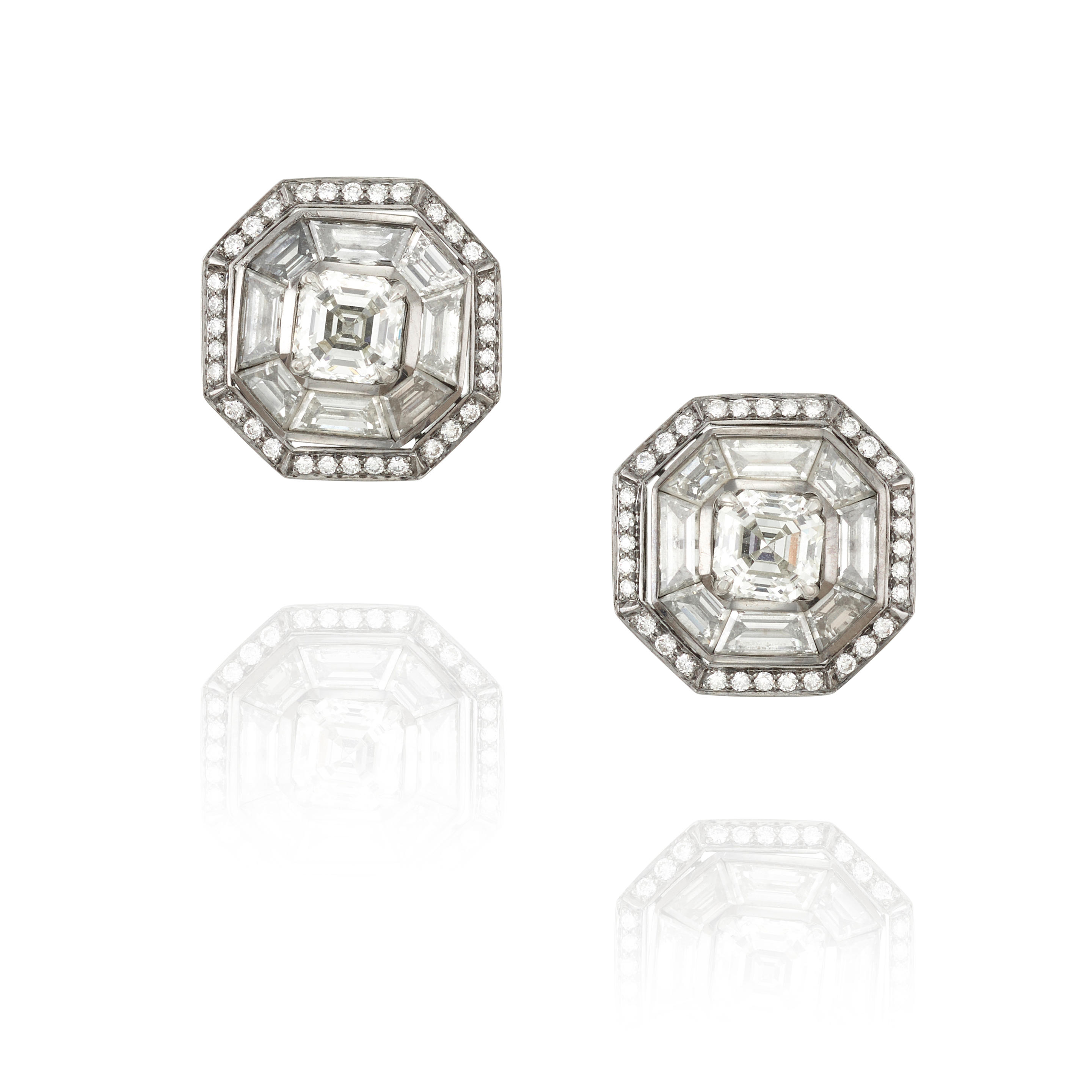 A PAIR OF PLATINUM AND DIAMOND EARRINGS Centering two square