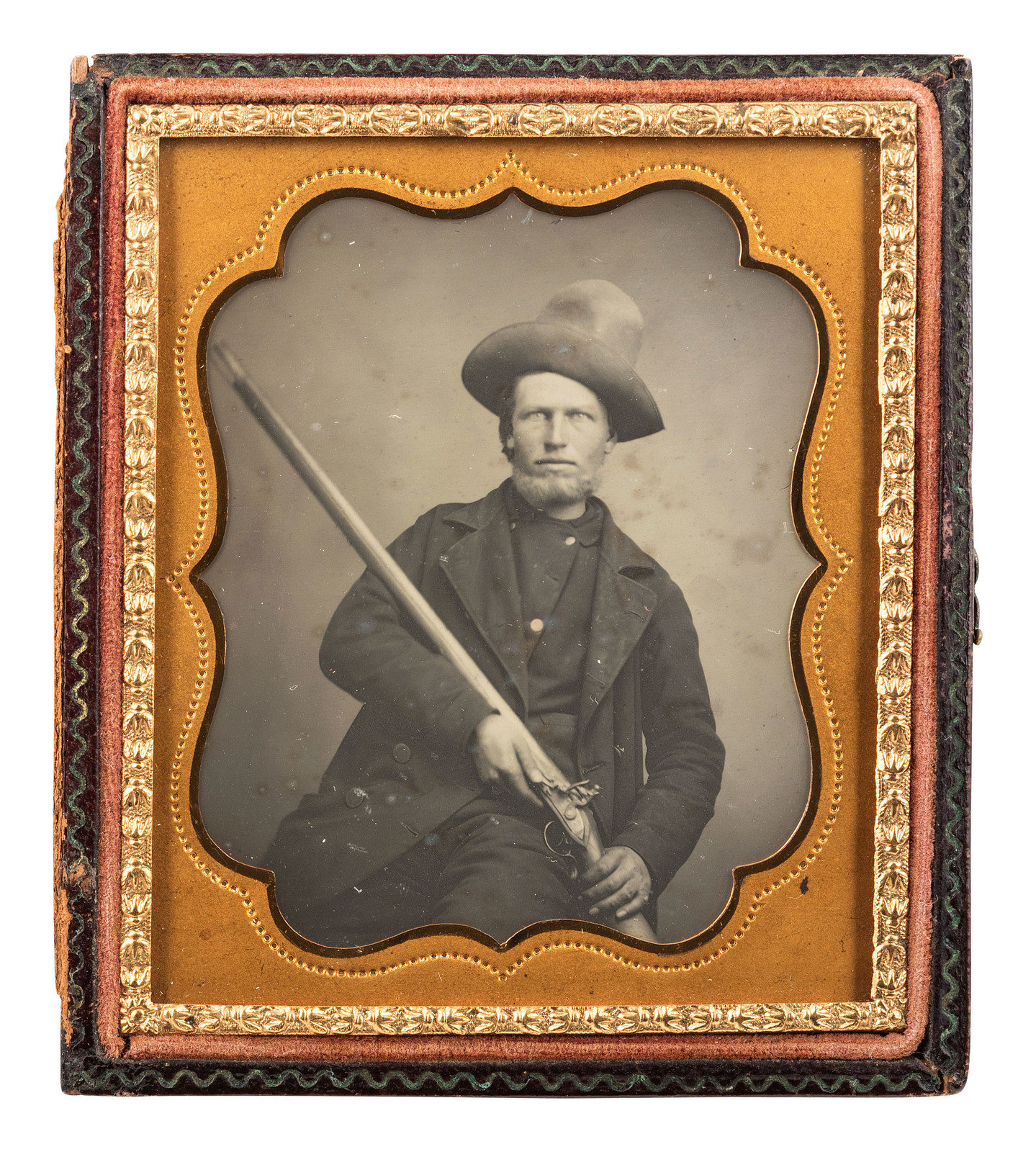 EARLY PHOTOGRAPHY Sixth plate daguerreotype of a tough outdoorsman holding