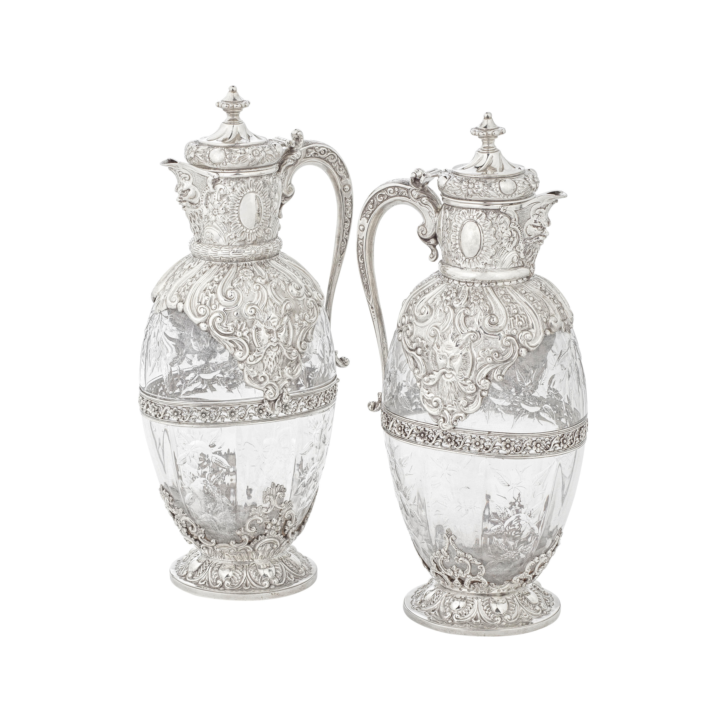 A PAIR OF VICTORIAN SILVER MOUNTED AND ROCK CRYSTAL CLARET