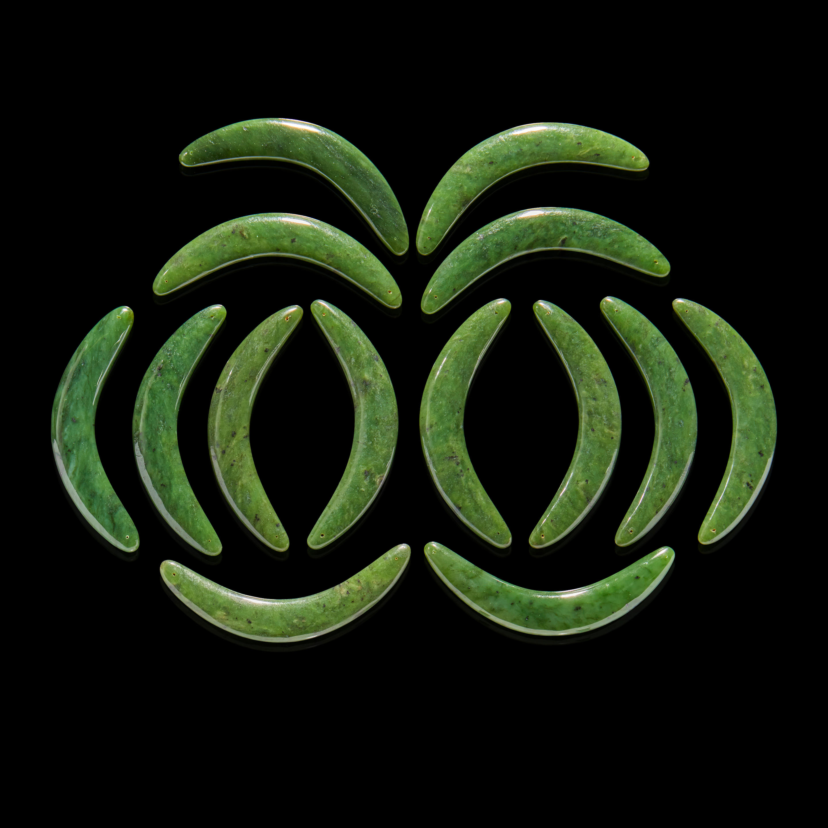 NEPHRITE JADE CARVED ARCS Comprising 14 nephrite jade carved arcs
