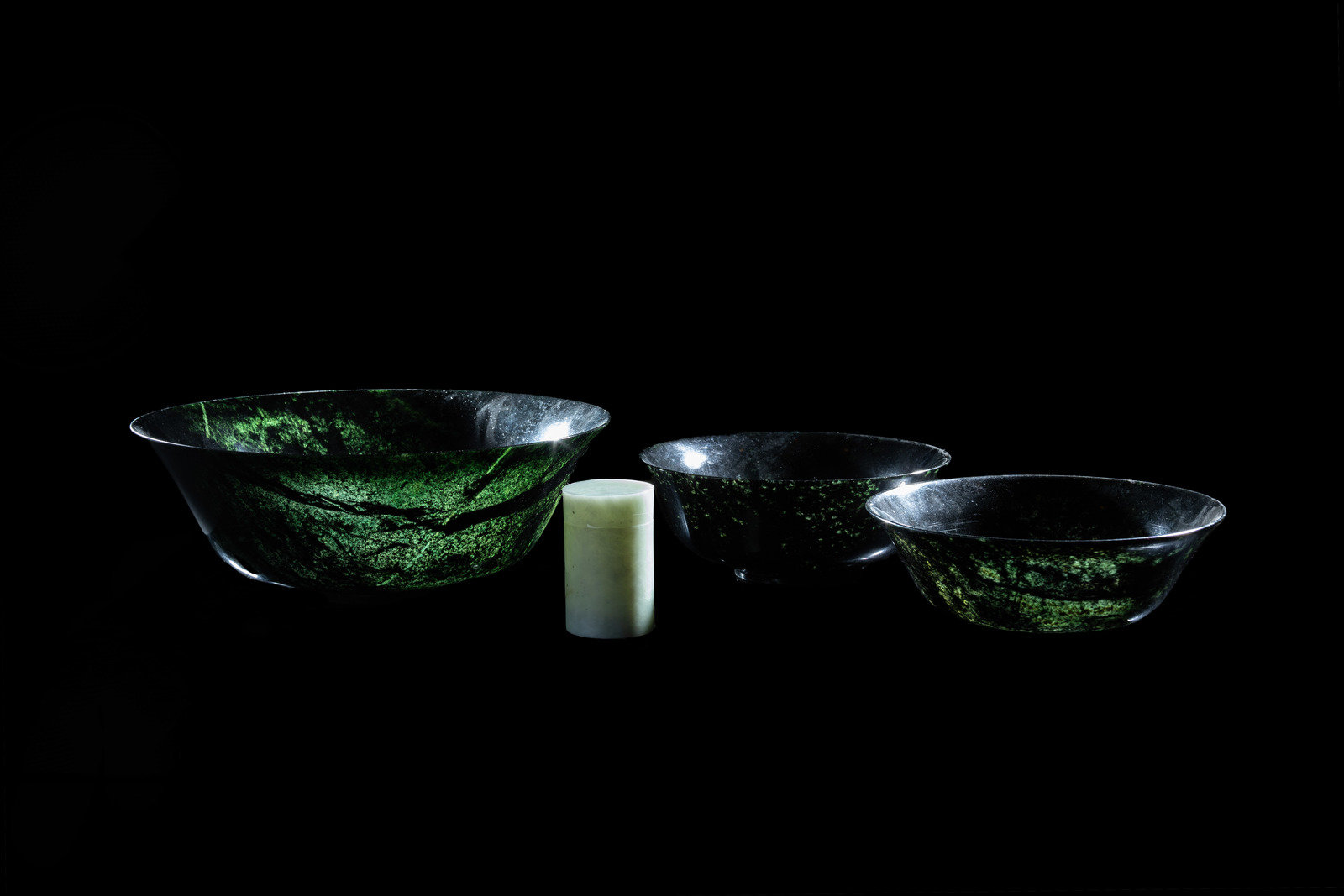 Three Chinese Spinach Jade Bowls and A Celadon Hardstone Covered
