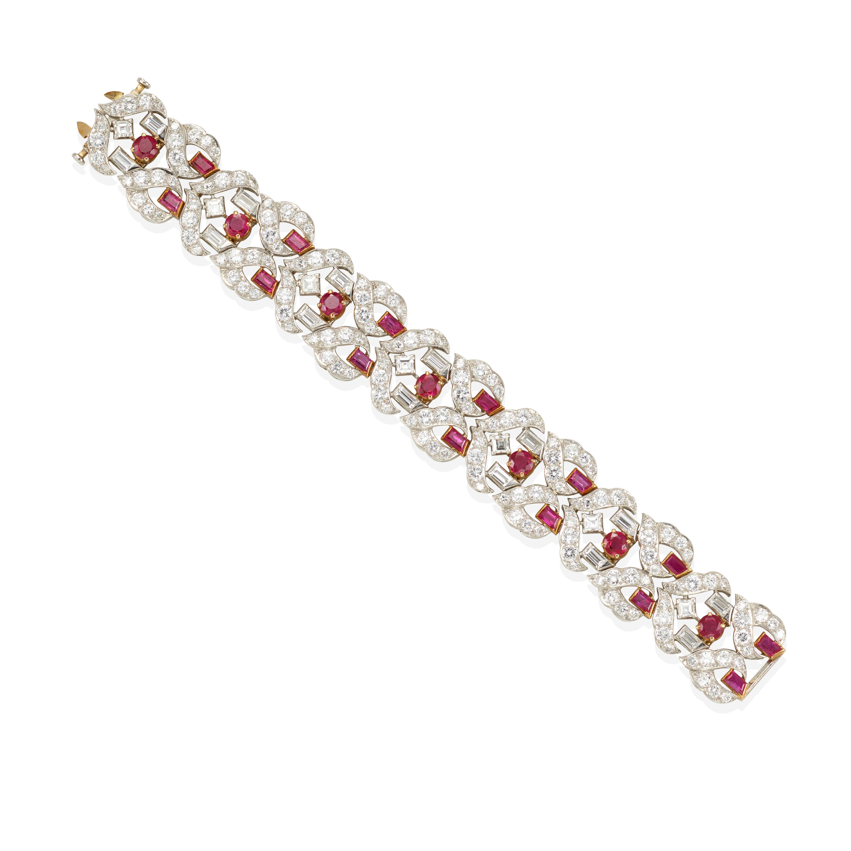 A PLATINUM GOLD RUBY AND DIAMOND BRACELET Featuring round and