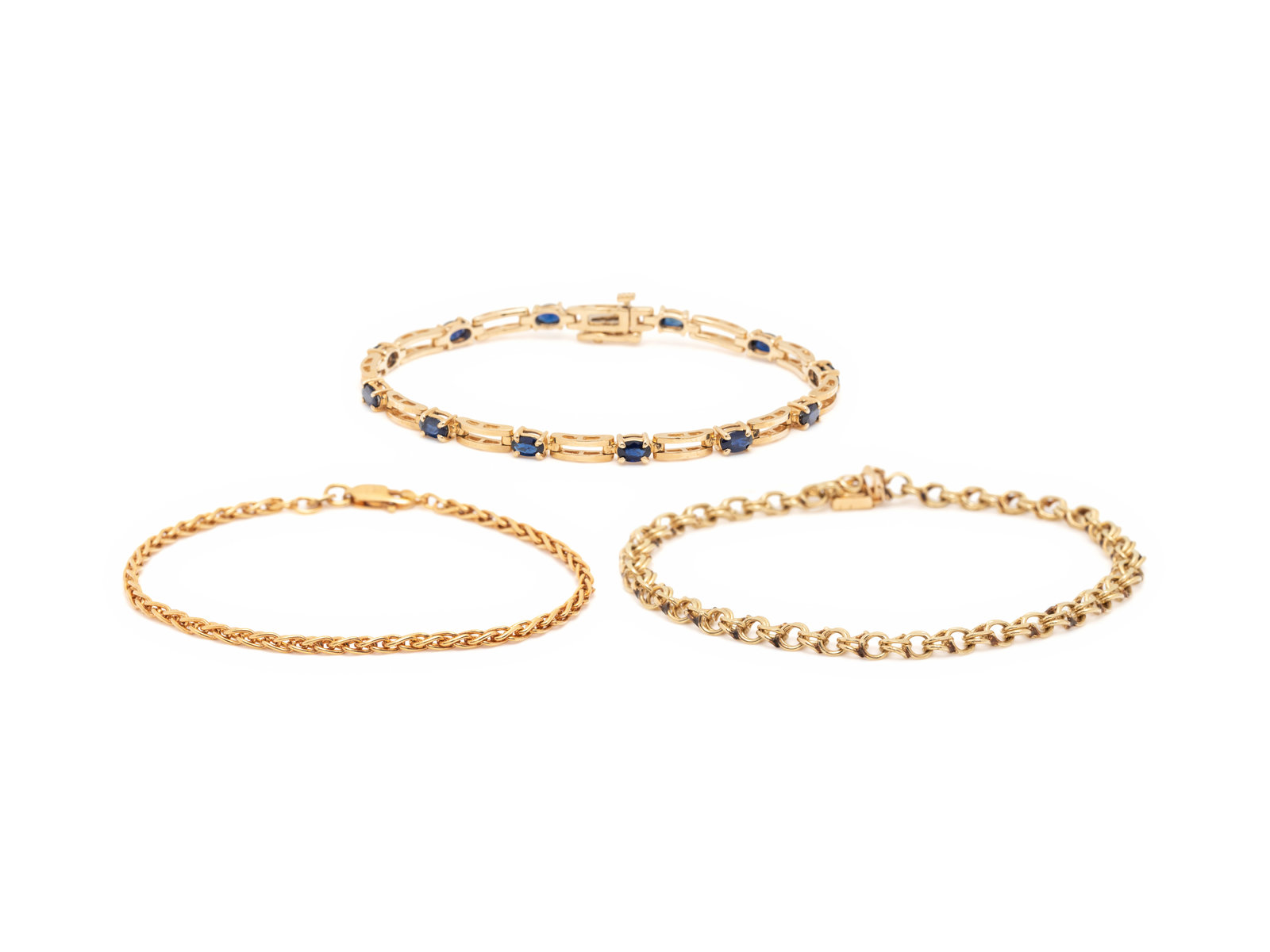 COLLECTION OF YELLOW GOLD BRACELETS Consisting of a wheat link