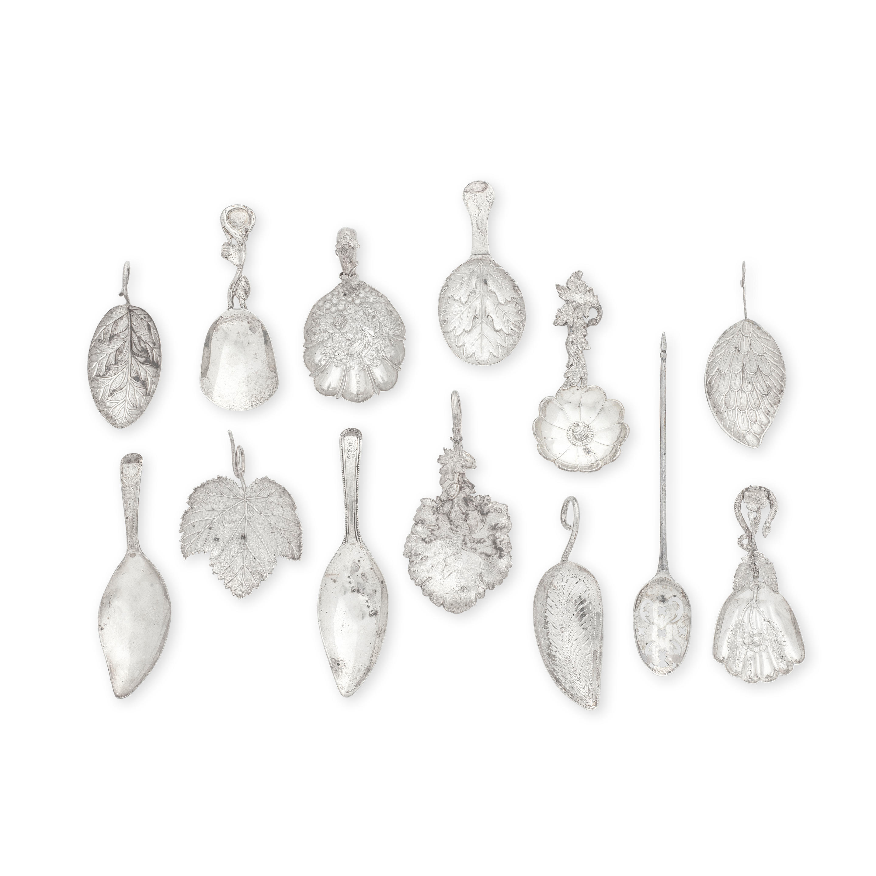 A COLLECTION OF TWELVE SILVER CADDY SPOONS AND A MOTE
