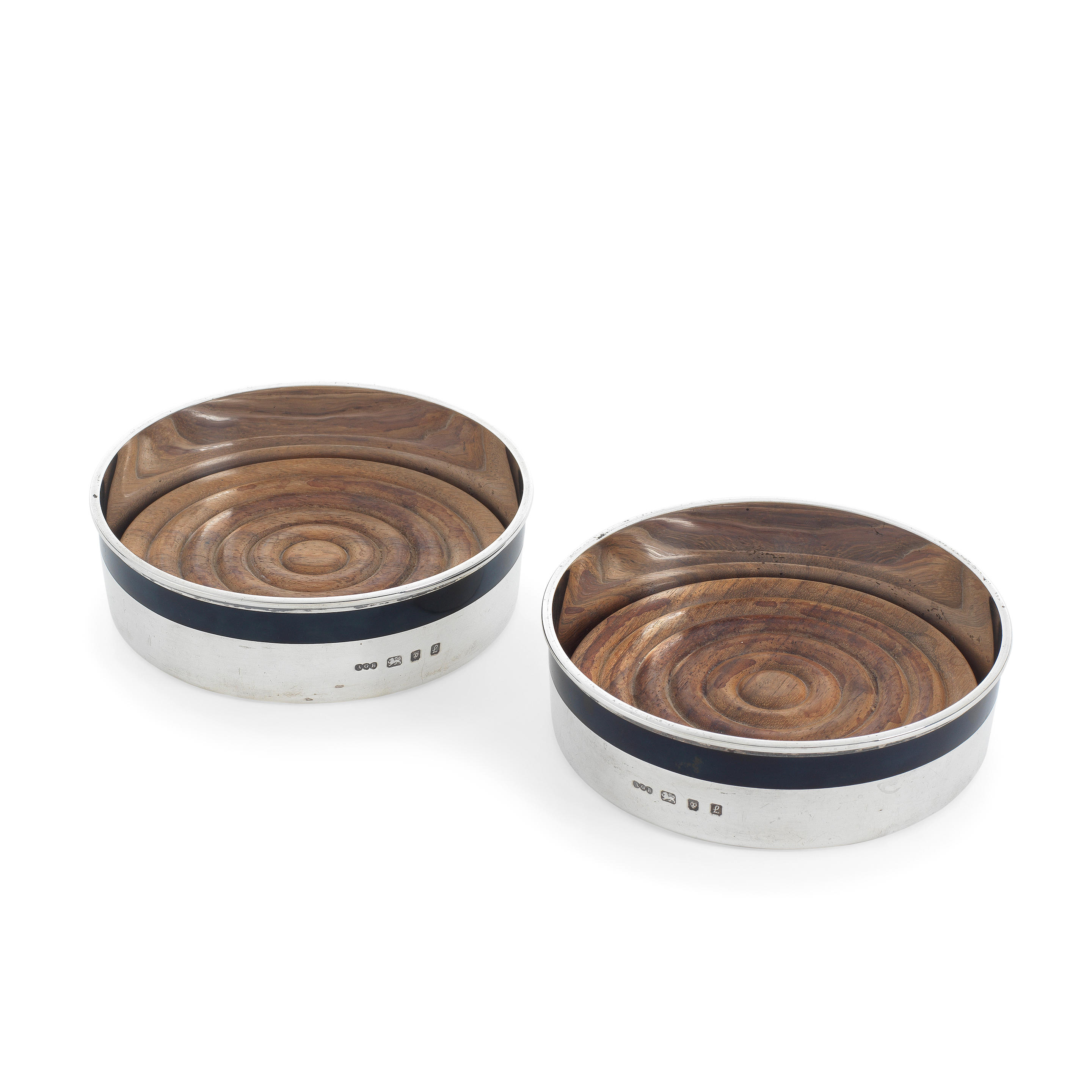 GERALD BENNEY A PAIR OF SILVER AND ENAMEL WINE COASTERS