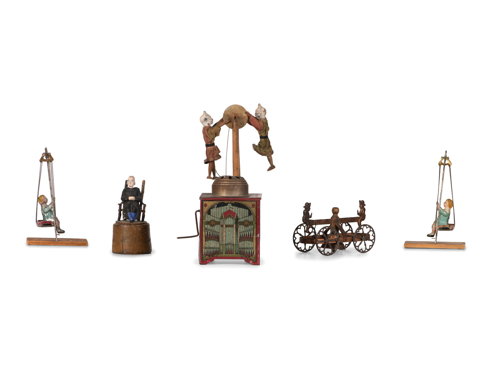 Six Figural Toys 20th Century comprising a German tin windup