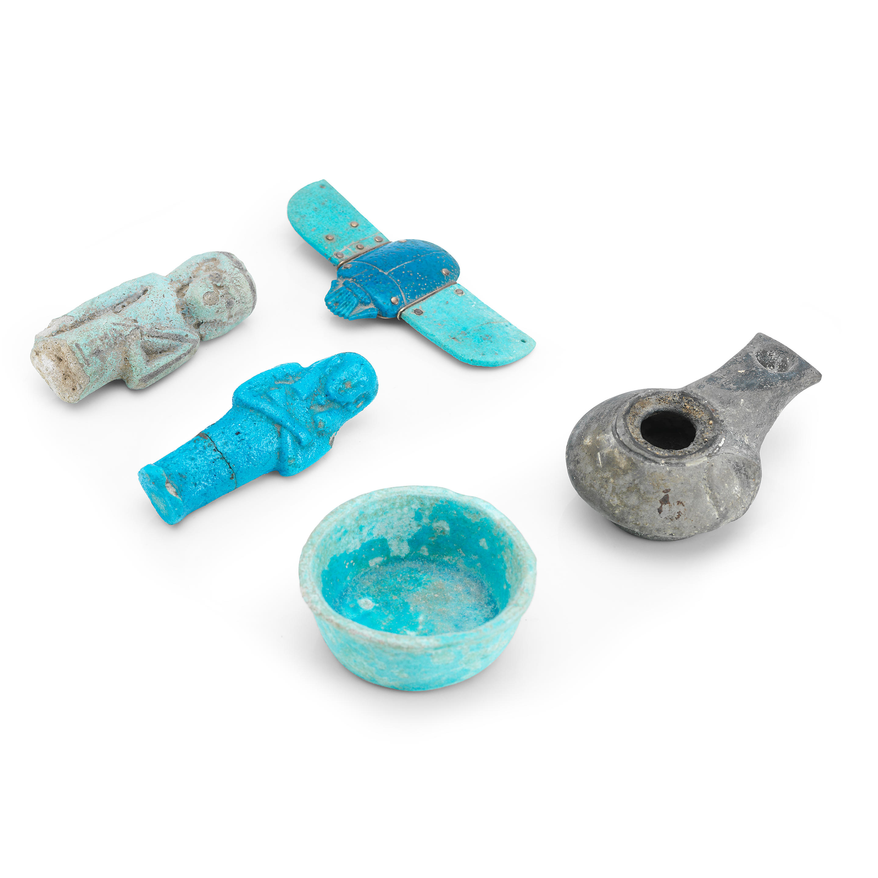 A GROUP OF EGYPTIAN BLUE FAIENCE OBJECTS A group of
