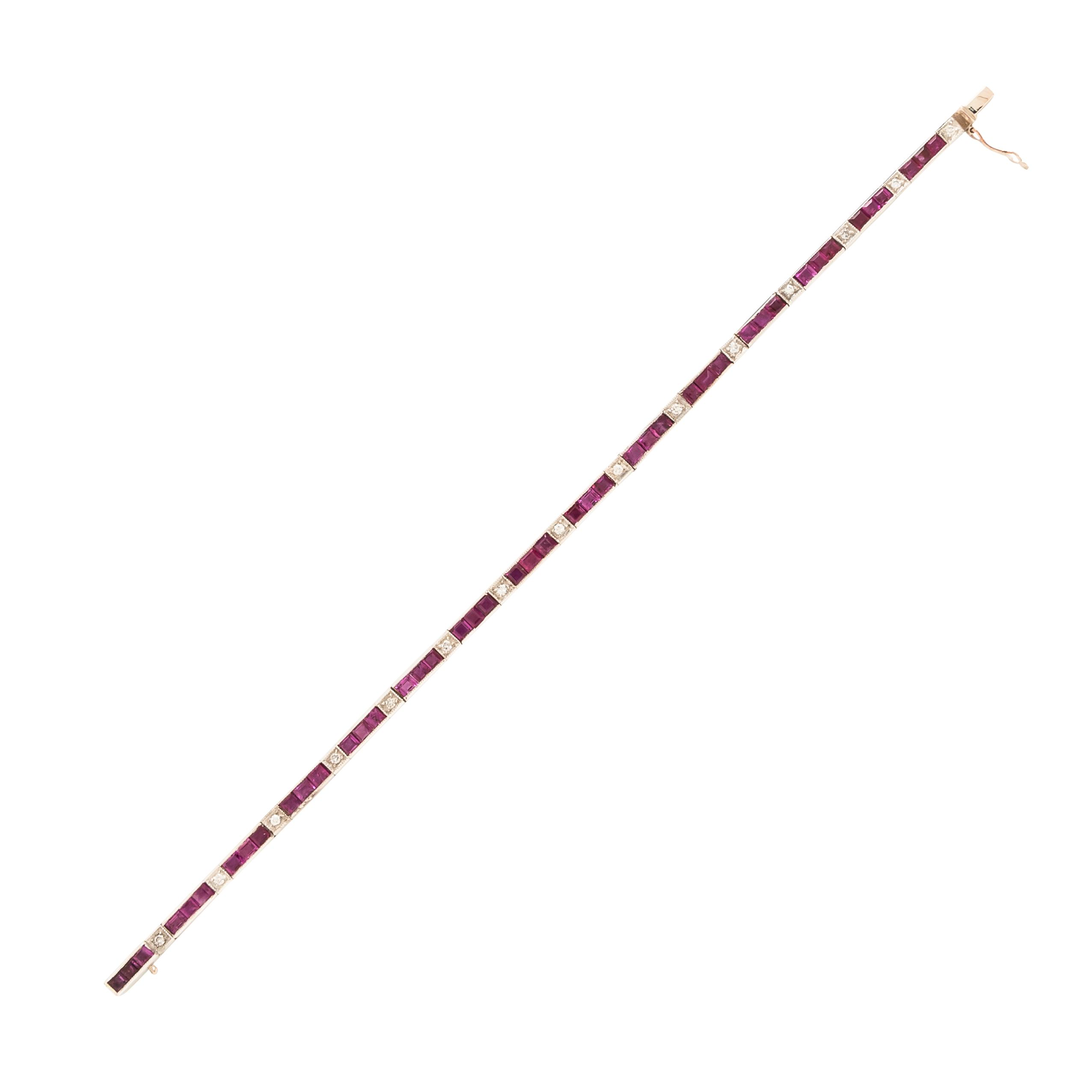 A RUBY AND DIAMOND BRACELET Set with channel set rubies