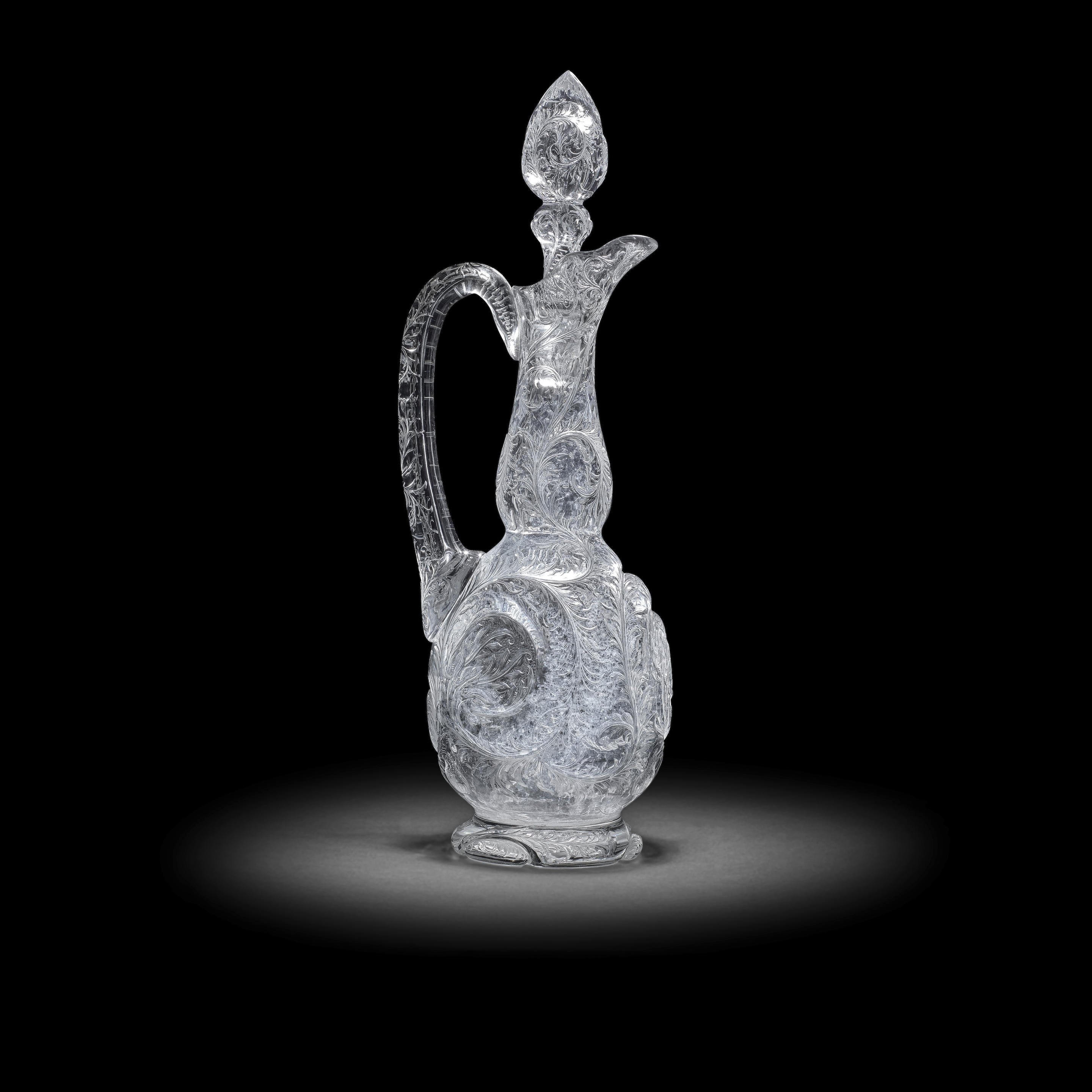 AN EXCEPTIONAL STEVENS AND WILLIAMS ROCK CRYSTAL CLARET JUG AND