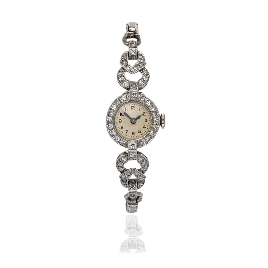 DIAMOND SET WRISTWATCH 1960 The circular white dial with Arabic