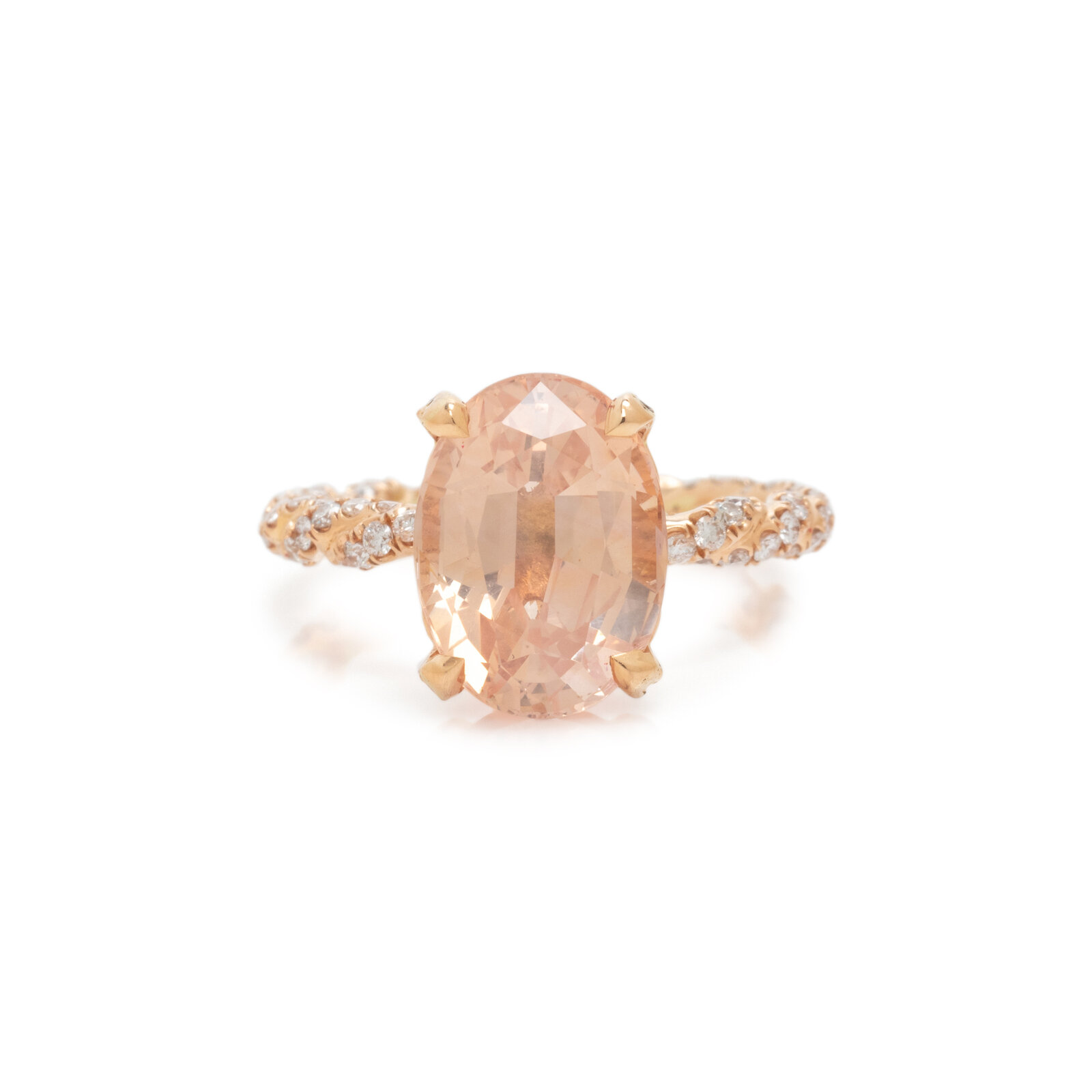 ORANGE SAPPHIRE AND DIAMOND RING Containing one oval mixed cut