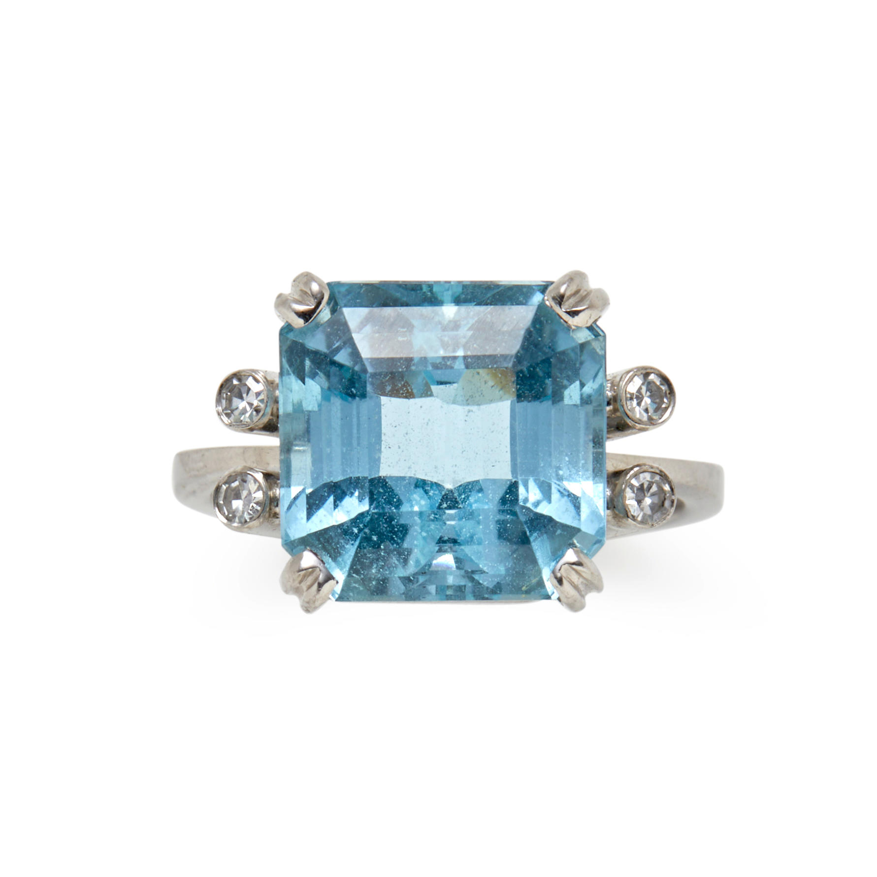 AN AQUAMARINE AND DIAMOND RING Centering a fancy cut aquamarine