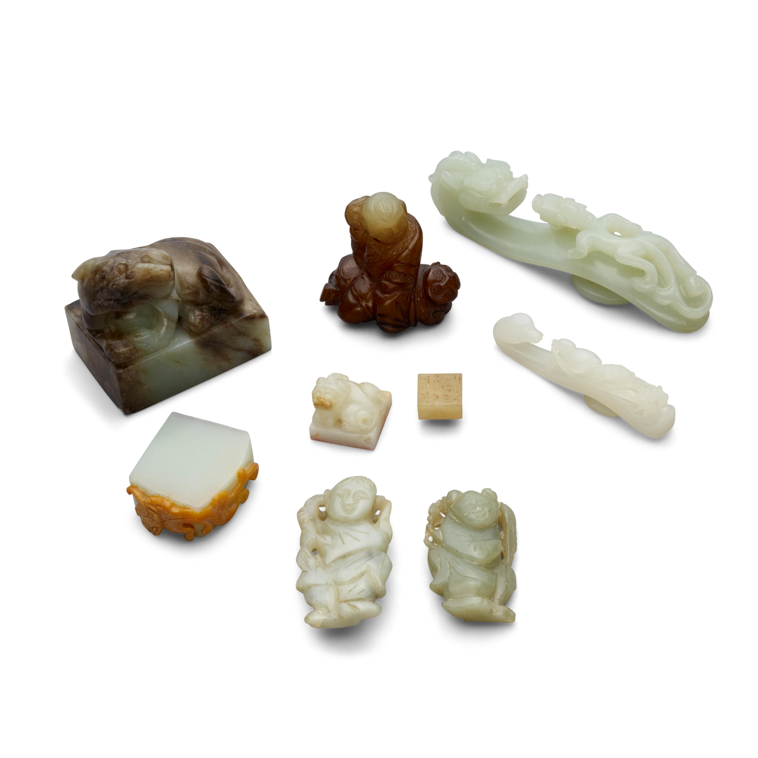 A GROUP OF NINE JADE CARVINGS 20th century Including three
