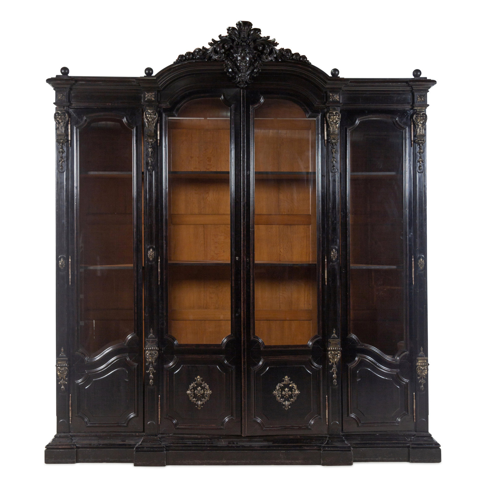 An Italian Rococo Revival Carved Ebonized Bookcase Late 19th Century