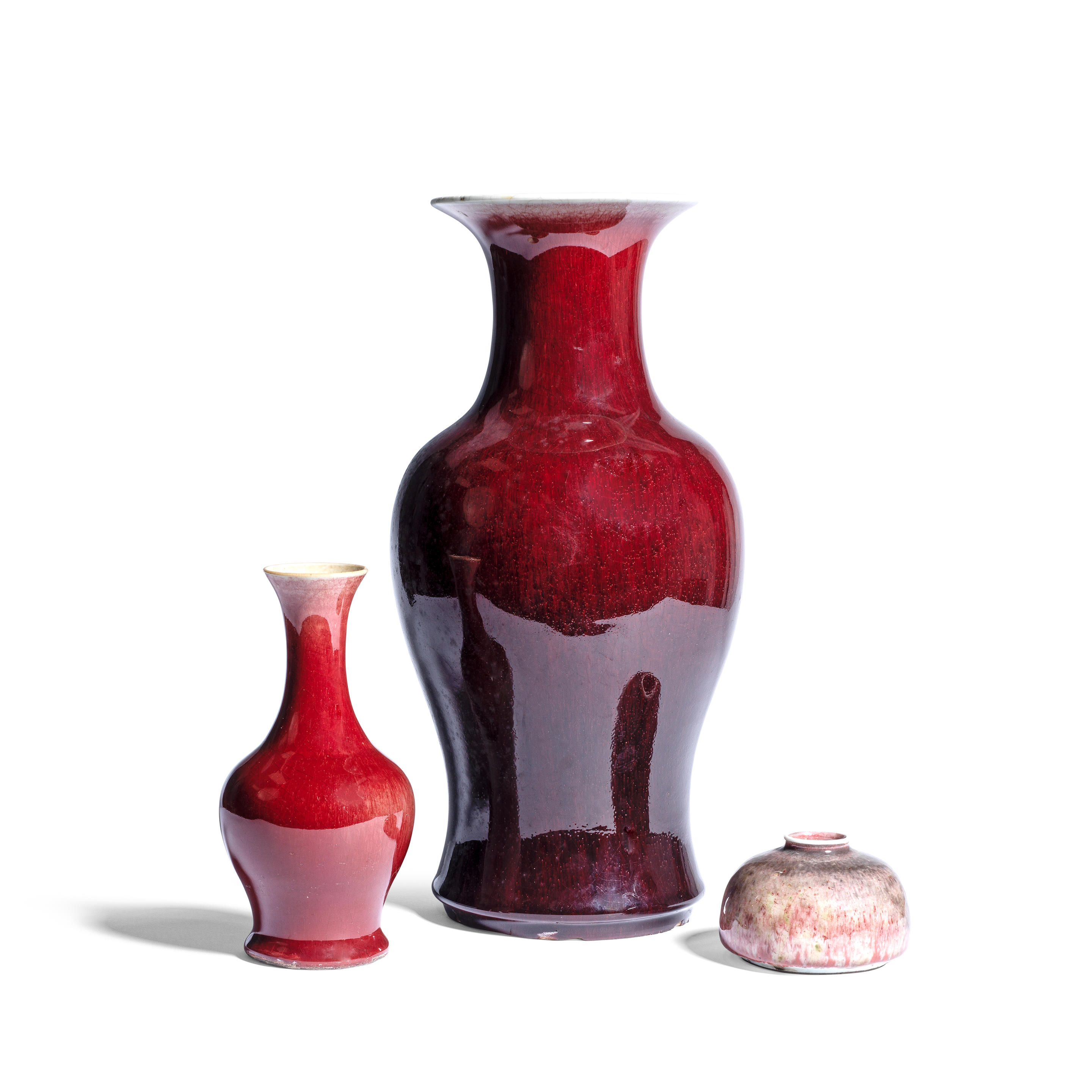 TWO SANG DE BOEUF GLAZED VASES AND A PEACHBLOOM GLAZED