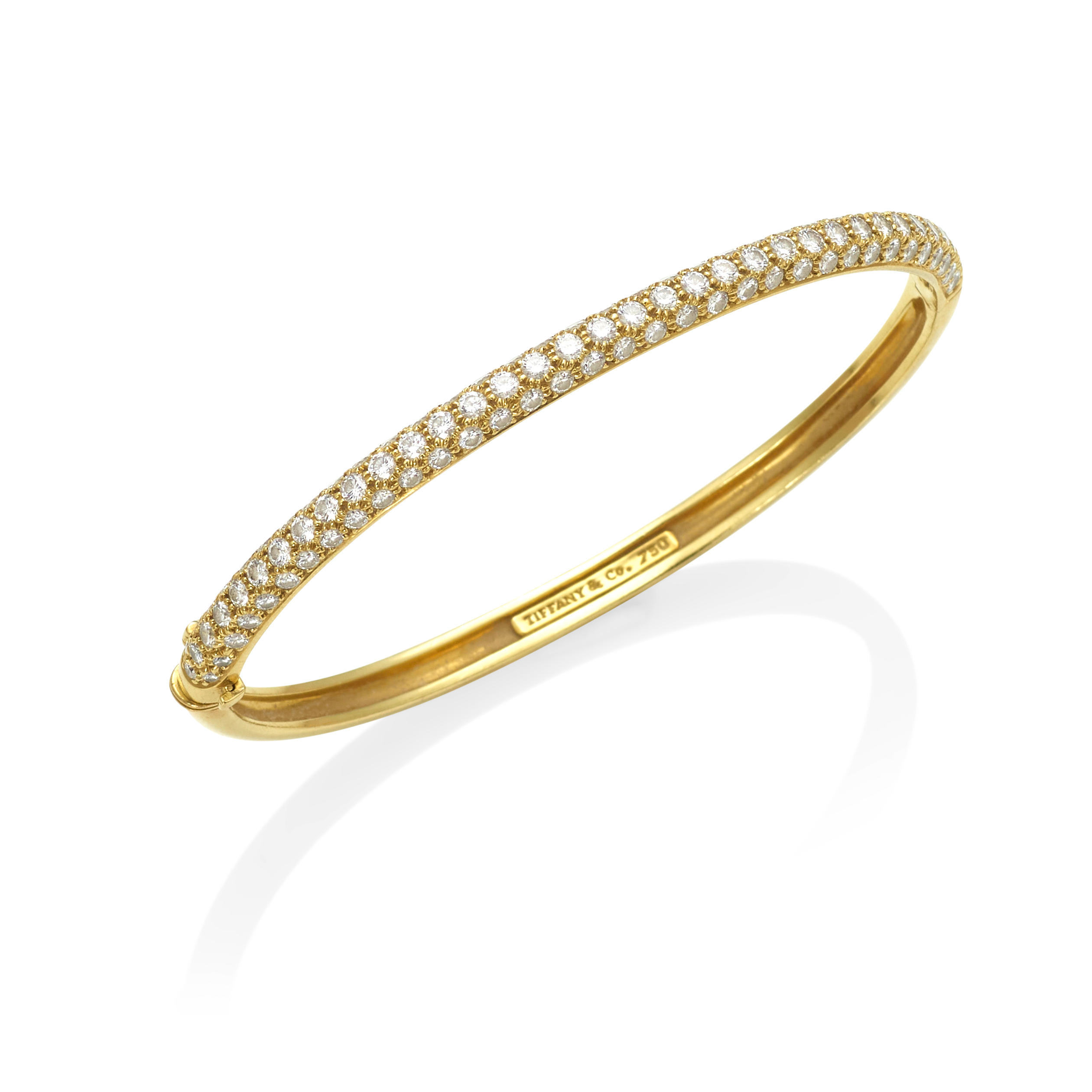 TIFFANY CO AN 18K GOLD AND DIAMOND HINGED BANGLE Featuring