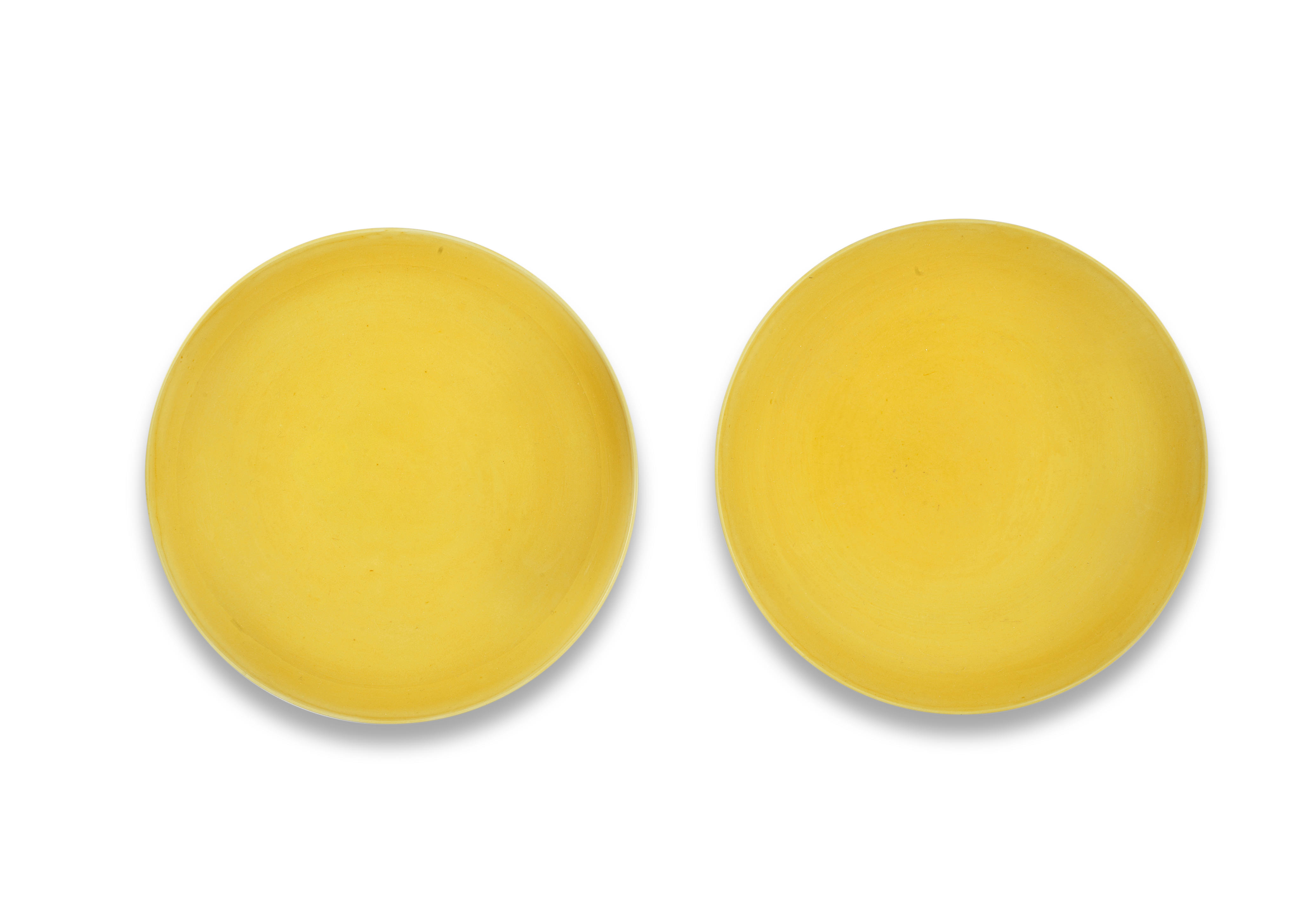 A PAIR OF YELLOW GLAZED INCISED SAUCER DISHES Yongzheng six