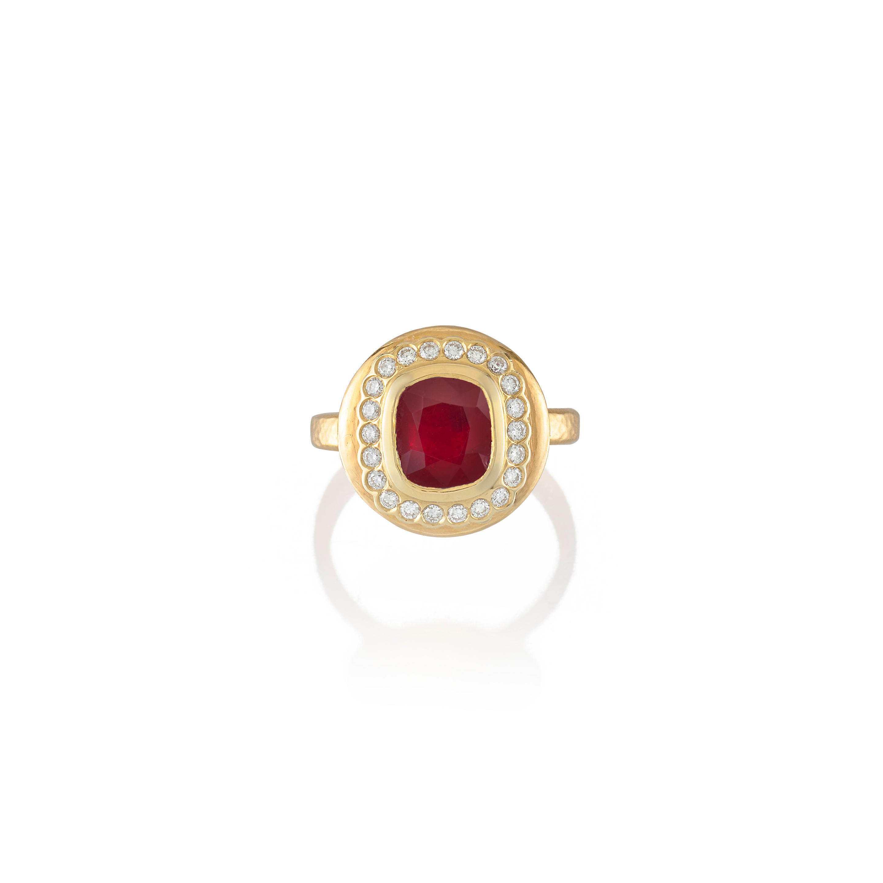 A RUBY AND DIAMOND RING Centering a bezel set ruby