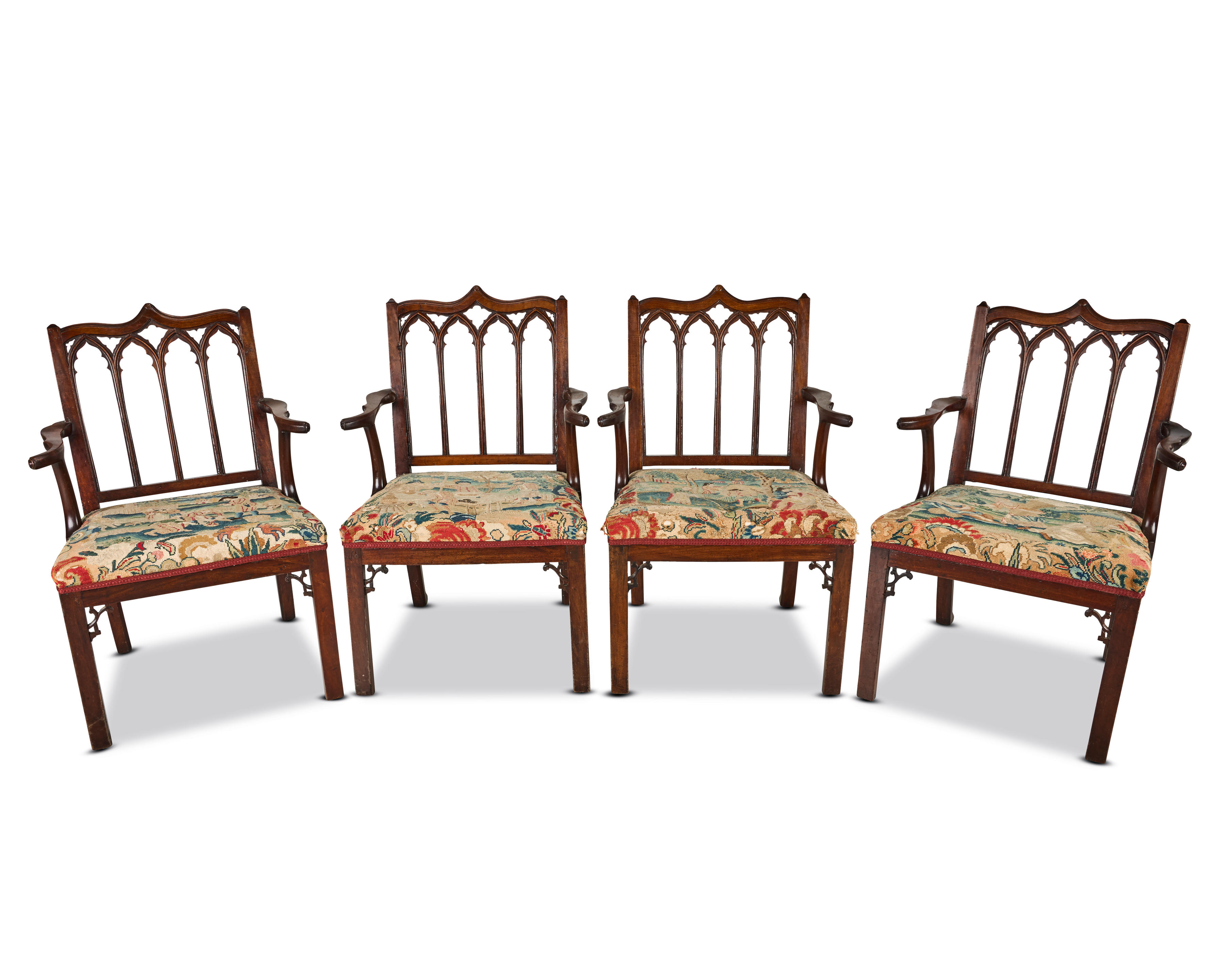A SET OF FOUR GEORGE III GOTHICK MAHOGANY OPEN ARMCHAIRS