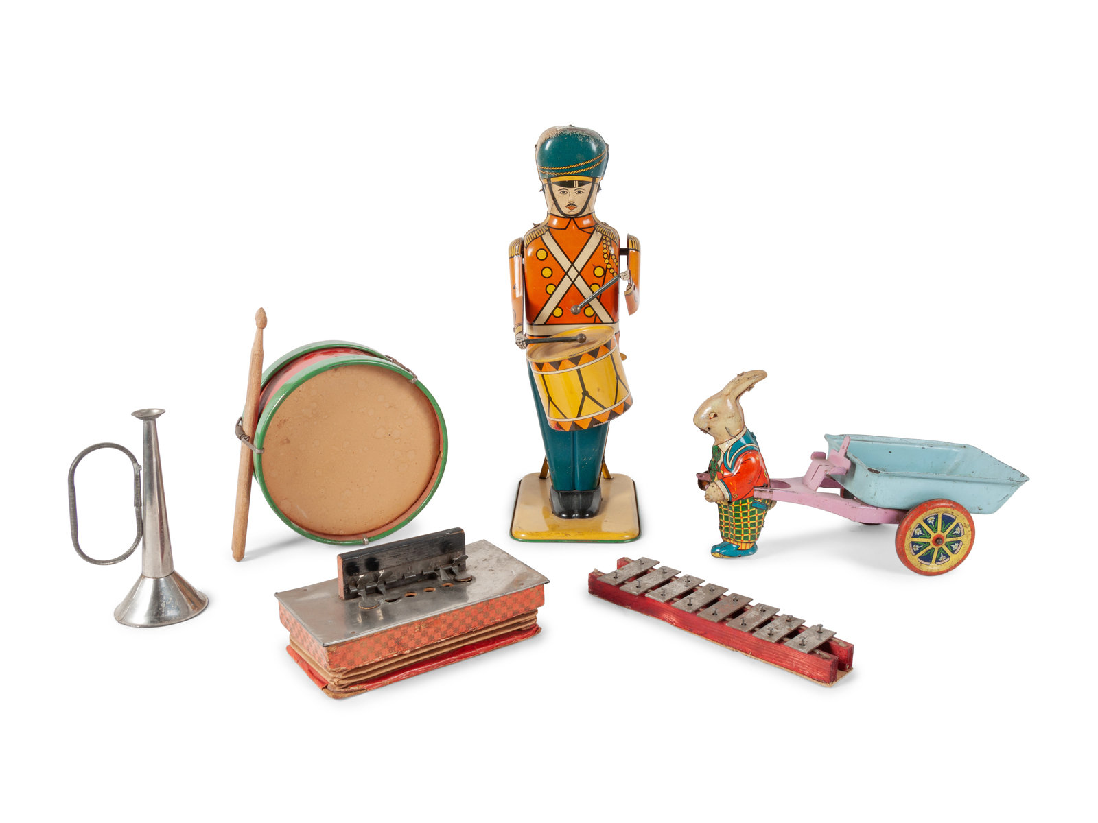 A Group of Children s Musical Instrument Toys and Tin