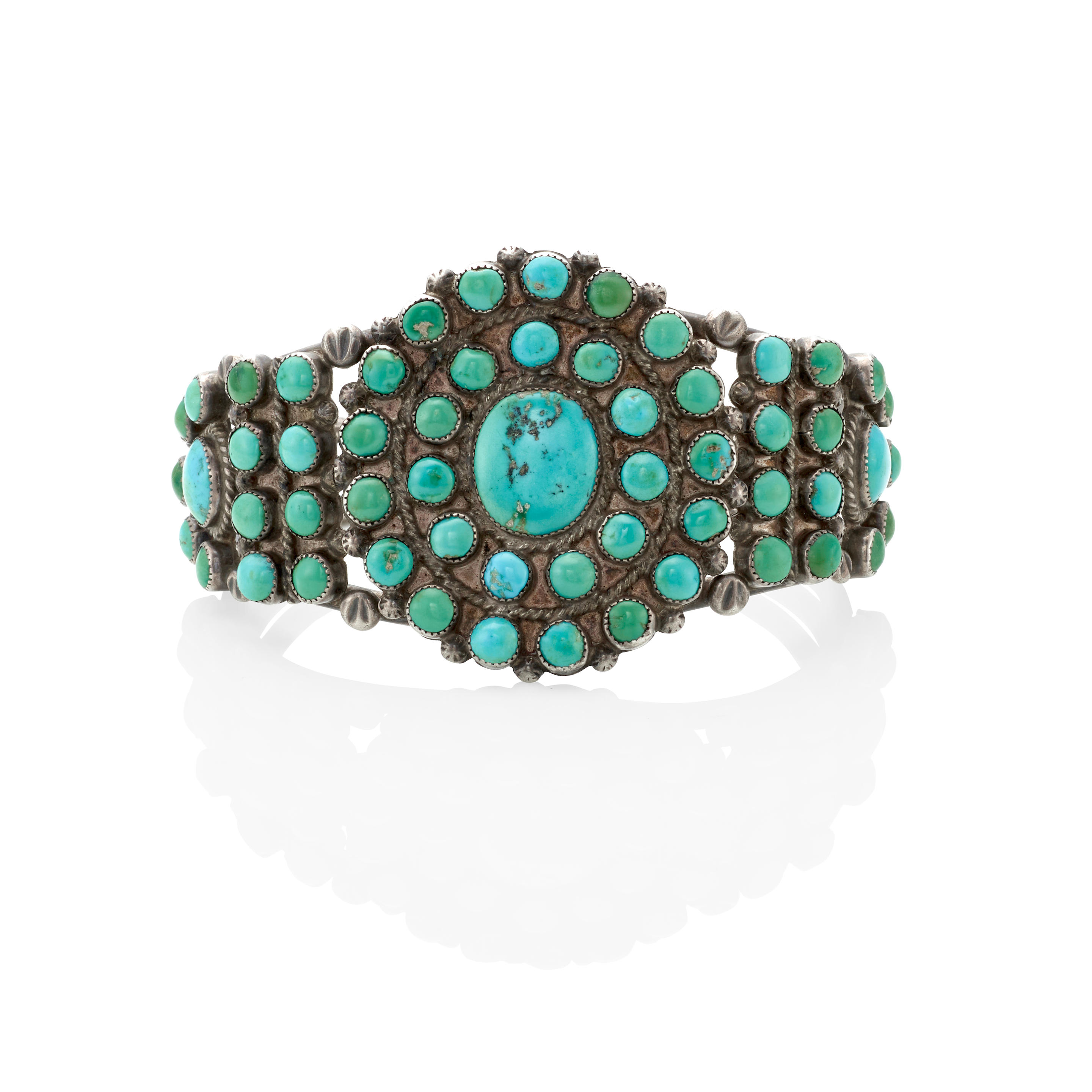 A ZUNI CUFF BRACELET Designed with three wires supporting clusters