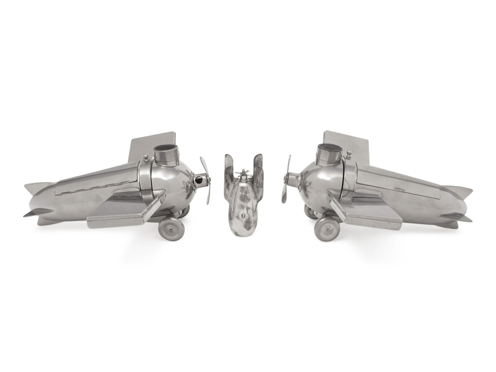 A Pair of German Chromed Metal Airplane Form Smoking Sets