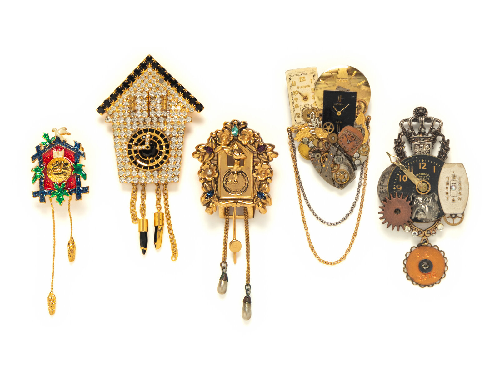 A GROUP OF FIVE TIMEPIECE THEMED BROOCHES THE FIRST Brooch
