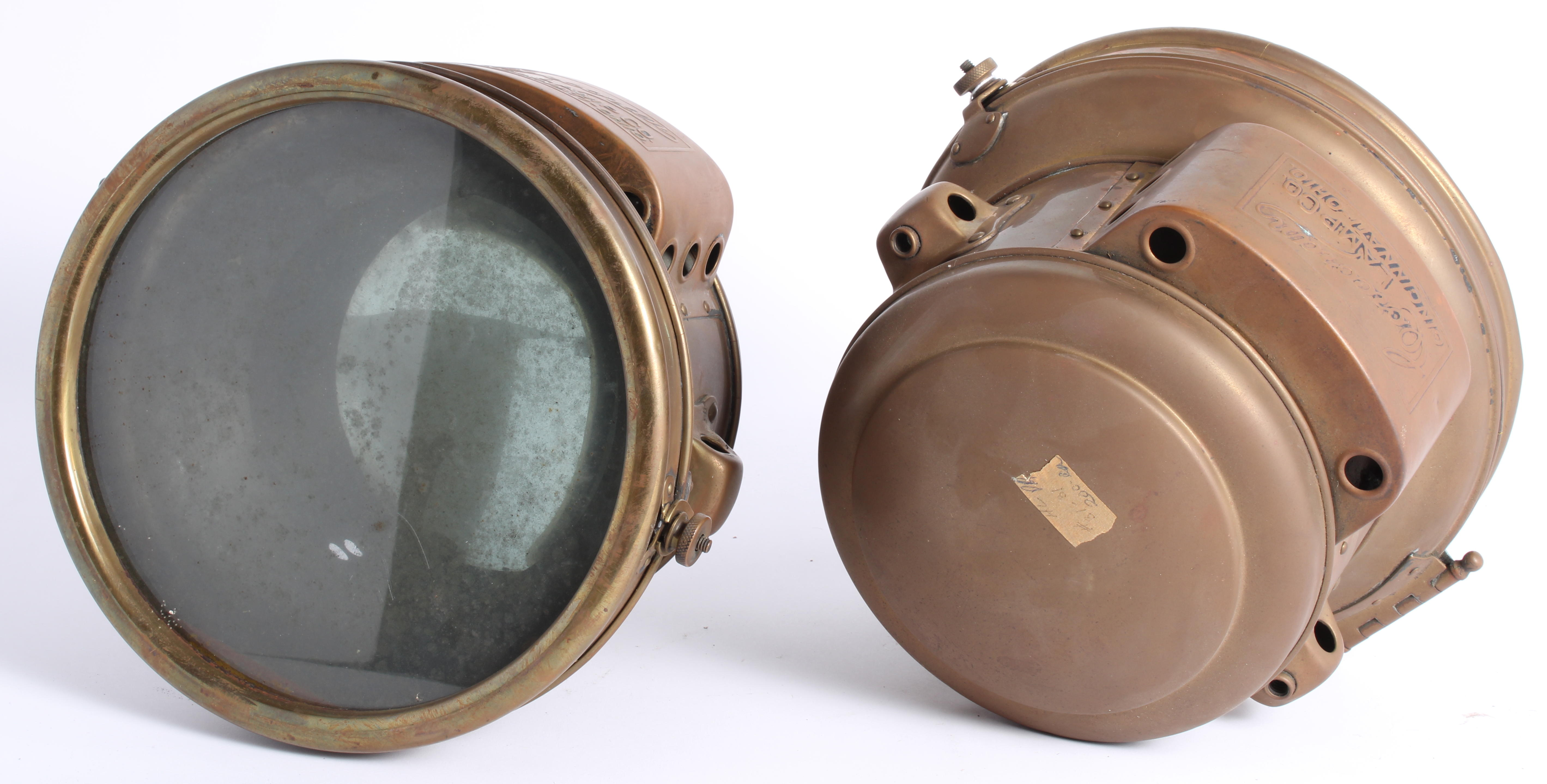 A PAIR OF ACETYLENE HEADLAMPS BY CORCORAN LAMP CO AMERICAN