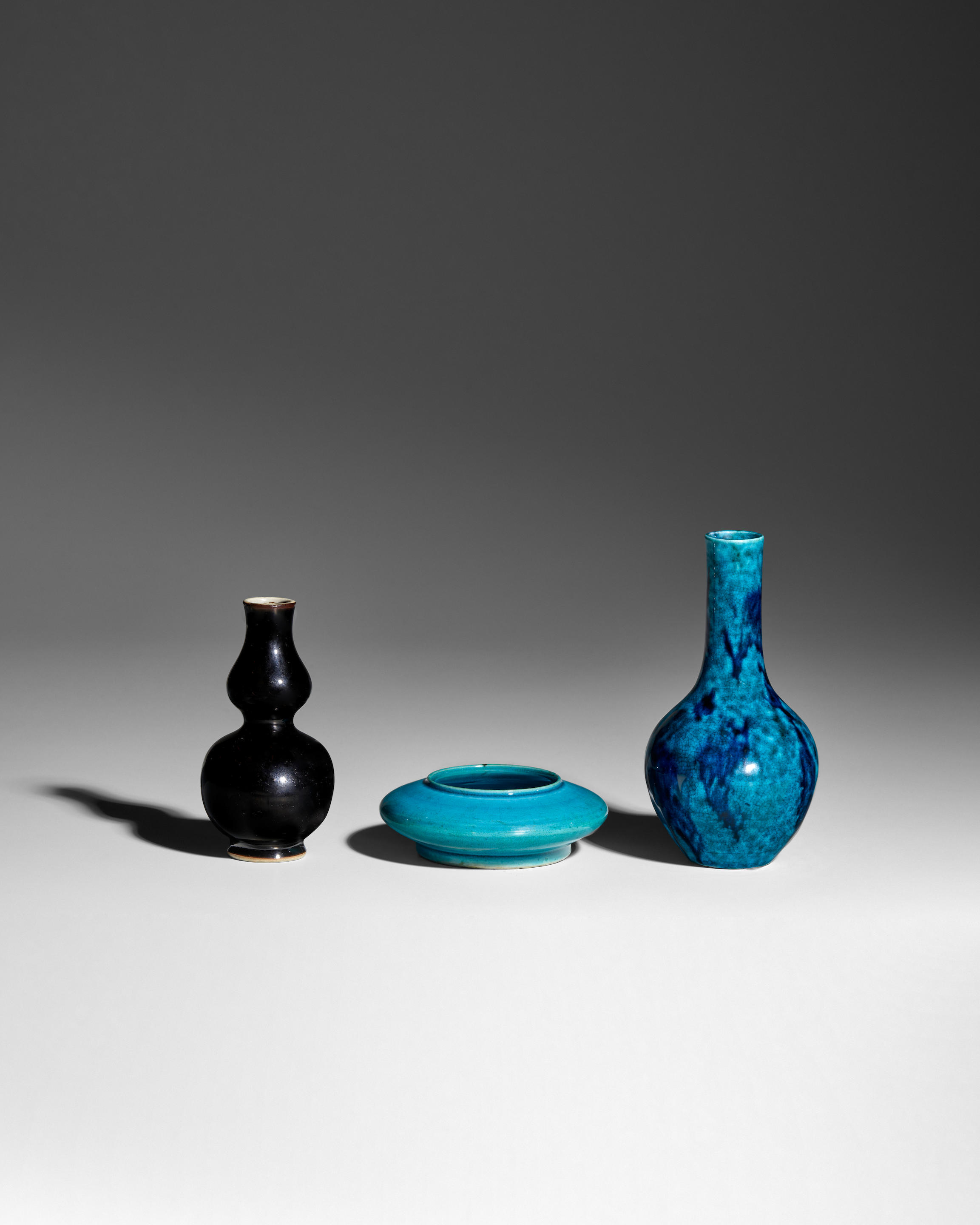 THREE MONOCHROME GLAZED VESSELS 18th early 19th century Comprising a