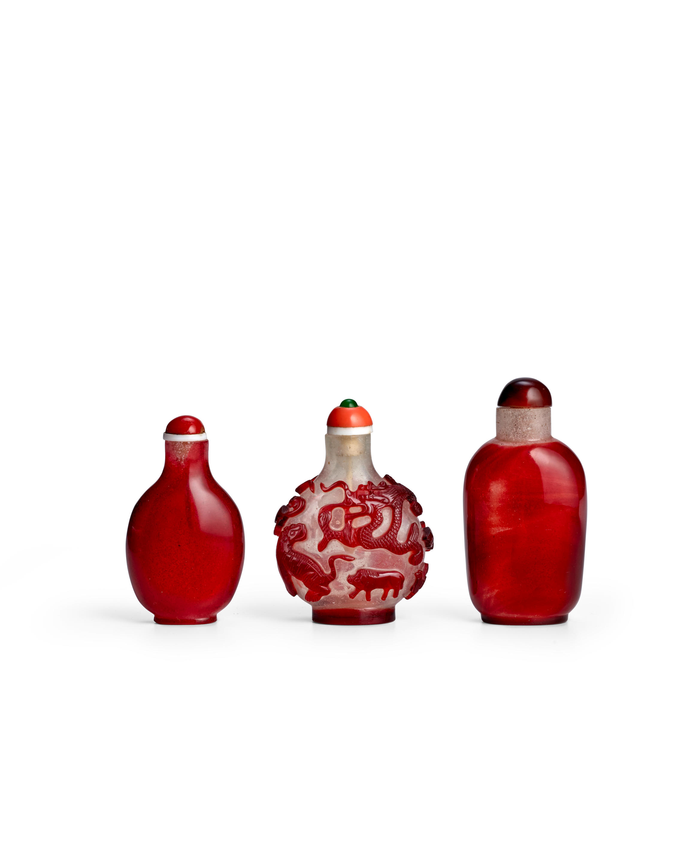 THREE RED OVERLAY GLASS BOTTLES the first 1770 1850 the